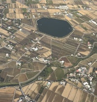 an aerial view of a rural area with a lake